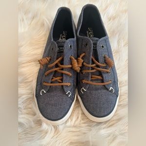Women’s Denim Sperry Boat shoes with tan tie.